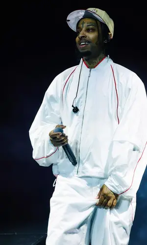 21 Savage wearing Nike pants