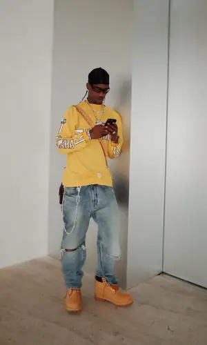 Travis Scott wearing Louis Vuitton bag