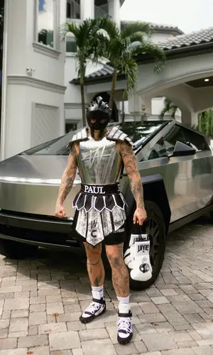 Jake Paul wearing Shoe Surgeon top