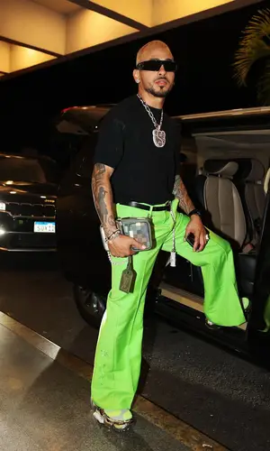 Ozuna’s Outfit in Cactus Jack Pants, Louis Vuitton Bag & Dior Eyewear (2024)