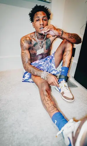 NBA YoungBoy wearing Bravest Studios shorts