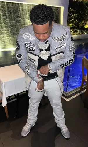 Finesse2tymes’ Outfit in Majestic Athletic Jacket, Jordan Sneakers & Louis Vuitton Belt (2024)