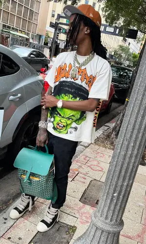 Baby Smoove’s Outfit in Rick Owens Sneakers, Goyard Backpack & New Era Cap (2024)