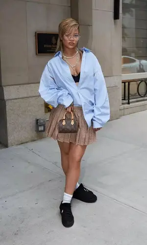 Rihanna’s Outfit in Miu Miu Pants, Puma Sneakers & Louis Vuitton Bag (2024)