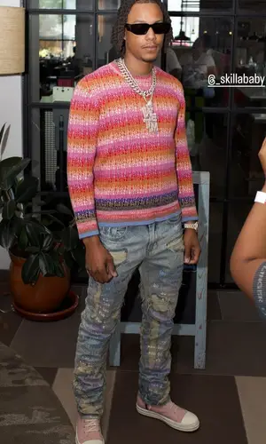 Skilla Baby’s Outfit in Marni Sweater, Who Decides War Jeans & Rick Owens Sneakers (2024)