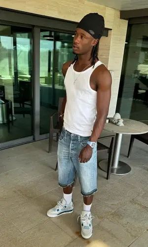 Eduardo Camavinga’s Outfit in Polo Ralph Lauren Top, Jordan Sneakers & Syna World Hat (2024)