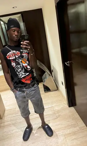 Eduardo Camavinga’s Outfit in Goat Crew T-Shirt, Louis Vuitton Belt & Syna World Hat (2024)