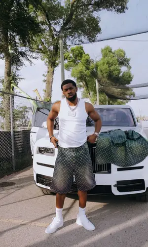 Tion Wayne’s Outfit in Louis Vuitton Shirt & Nike Socks (2024)