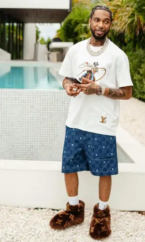 Key Glock wearing Louis Vuitton shorts