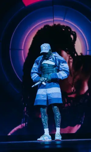 Chris Brown’s Outfit in Louis Vuitton Shirt & Nike Sneakers (2024)