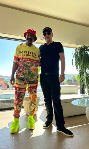 Dennis Graham wearing Amazon sneakers