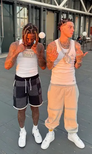 Lil Durk’s Outfit in Hanes Top, Louis Vuitton Shorts & Nike Sneakers (2024)