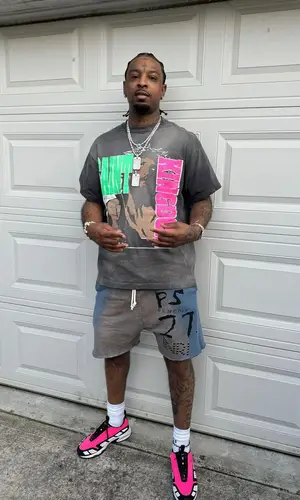 21 Savage wearing Saint Michael t-shirt