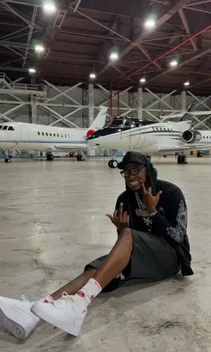 Rob49 wearing Chrome Hearts cap
