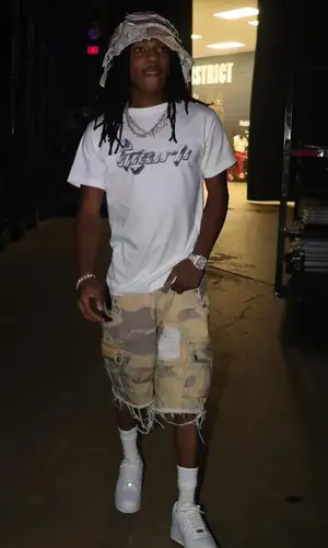 Young Scooter wearing Note Chaser shorts