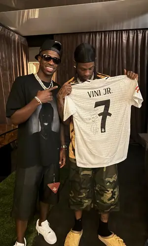 Vinicius Jr’s Outfit in Travis Scott Merch T-Shirt, Prada Shorts & Nike Sneakers (2024)