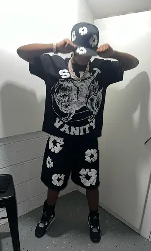 Lil 50 wearing New Era cap