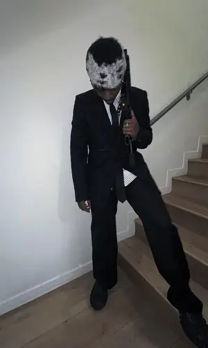 UnoTheActivist wearing Raf Simons jacket