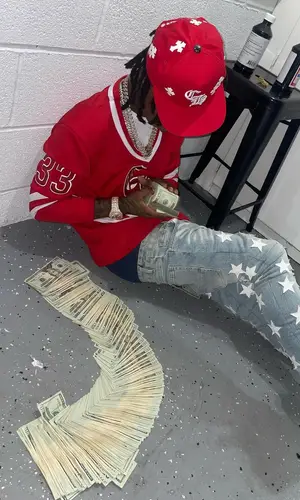 Lil 50 wearing Chrome Hearts jersey