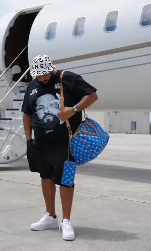 DJ Khaled wearing Louis Vuitton bag