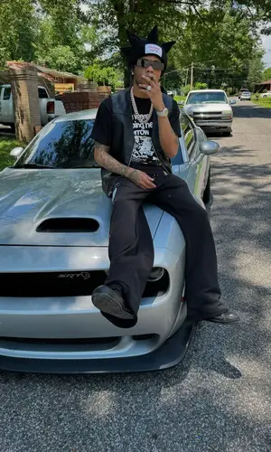 Lil Migo’s Outfit in Supreme Jacket, Rick Owens Eyewear & Loverboy by Charles Jeffrey Hat (2024)