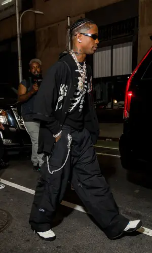 Travis Scott wearing Balenciaga pants