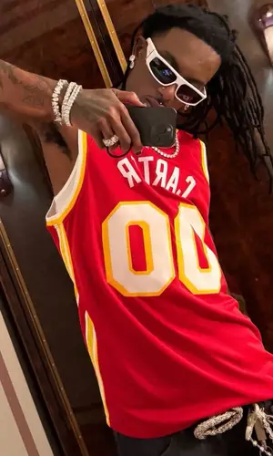 Playboi Carti wearing Nike jersey