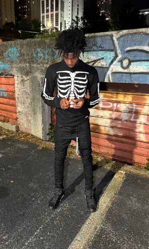 Lazer Dim 700 wearing Supreme top