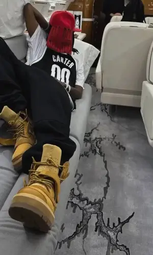 Playboi Carti wearing Playboi Carti Merch hat