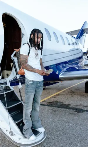 Polo G wearing Goyard backpack