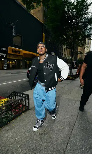 DaBaby’s Outfit in Louis Vuitton Jacket, B.B. Simon Belt & Prada Eyewear (2024)