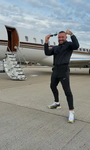 Conor McGregor’s Outfit in Nike Jacket, Patek Philippe Watch & Versace Eyewear (2024)