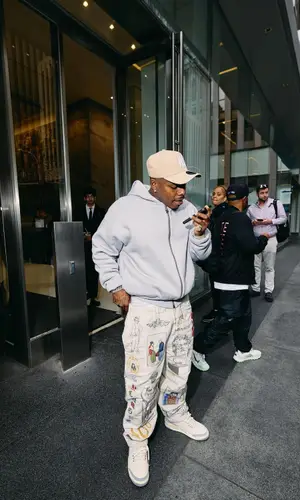 DaBaby’s Outfit in Jordan Sneakers, Louis Vuitton Eyewear & New Era Cap (2024)