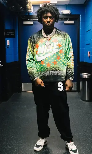 Fredo Bang’s Outfit in Nike Sweater, Supreme Pants & Cactus Plant Flea Market (2024)