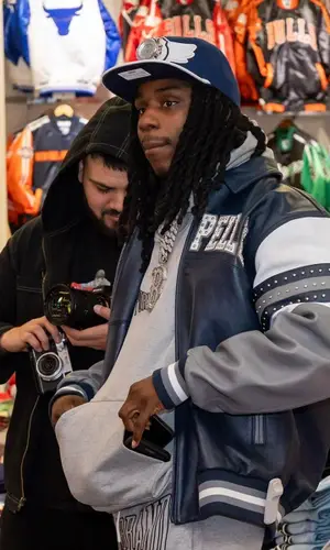 Polo G wearing Breyers cap