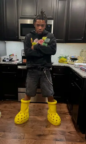 Lil Migo wearing Crocs boots