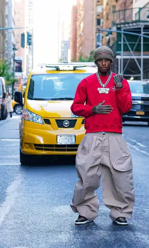 NLE Choppa wearing Supreme sweater