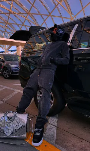 NLE Choppa wearing Louis Vuitton scarf
