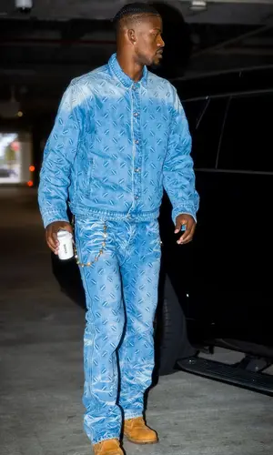 Jimmy Butler wearing Who Decides War jacket