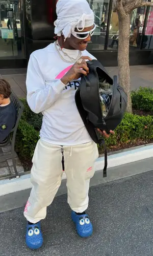 Famous Dex’s Outfit in Ski Top, Prada Eyewear & McDonald's Merch Sandals (2024)