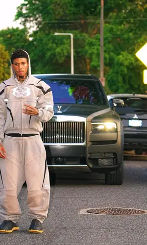 NLE Choppa wearing NLE Choppa Merch boots