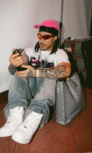 PlaqueBoyMax wearing Supreme cap