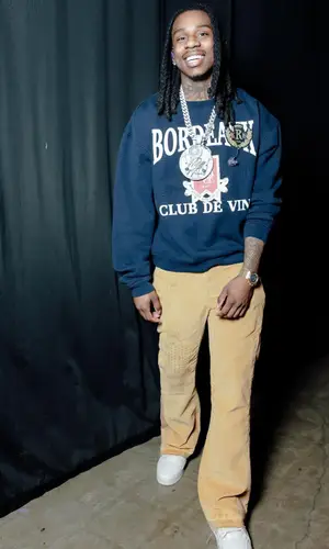 Polo G’s Outfit in Rhude Sweater, Gallery Dept. Pants & Louis Vuitton Sneakers (2024)