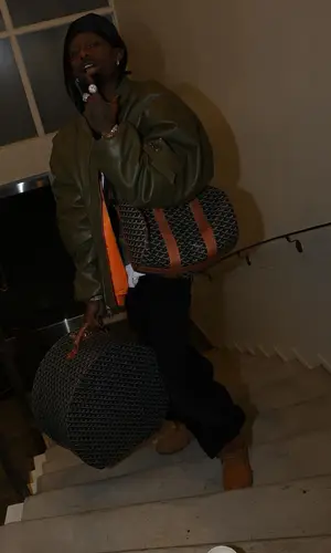 Playboi Carti wearing Goyard bag