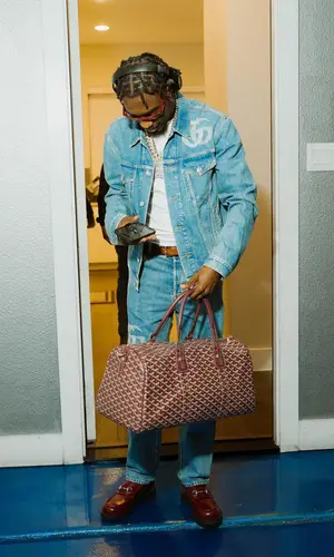 Lil Tjay wearing Gucci boots