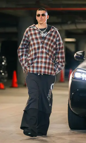 Tyler Herro’s Outfit in Maison Margiela Shirt, Satoshi Nakamoto Pants & Nike Sneakers (2024)