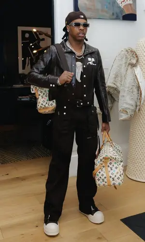 Lil Baby wearing Louis Vuitton backpack