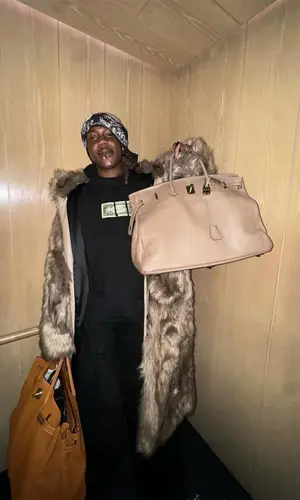 Destroy Lonely wearing Hermes bag