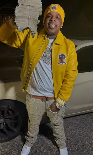 Finesse2tymes’ Outfit in Nike Sneakers, Louis Vuitton Belt & Avirex Hat (2025)