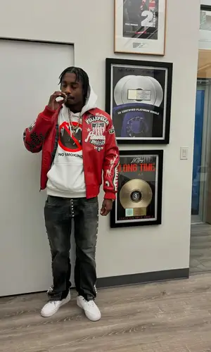 Lil Tjay wearing B.B. Simon belt